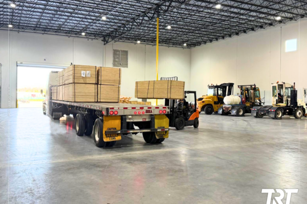 Transloading services — trailers and forklifts inside a Savannah warehouse