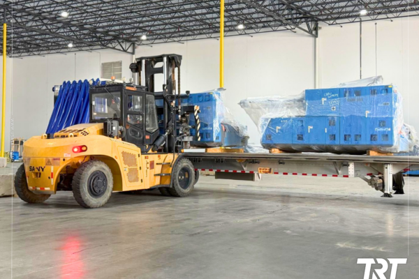 Cross-dock services — forklift loading palletized cargo onto a trailer